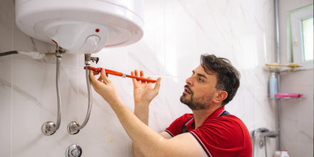 Plumbing working on a hot water heater