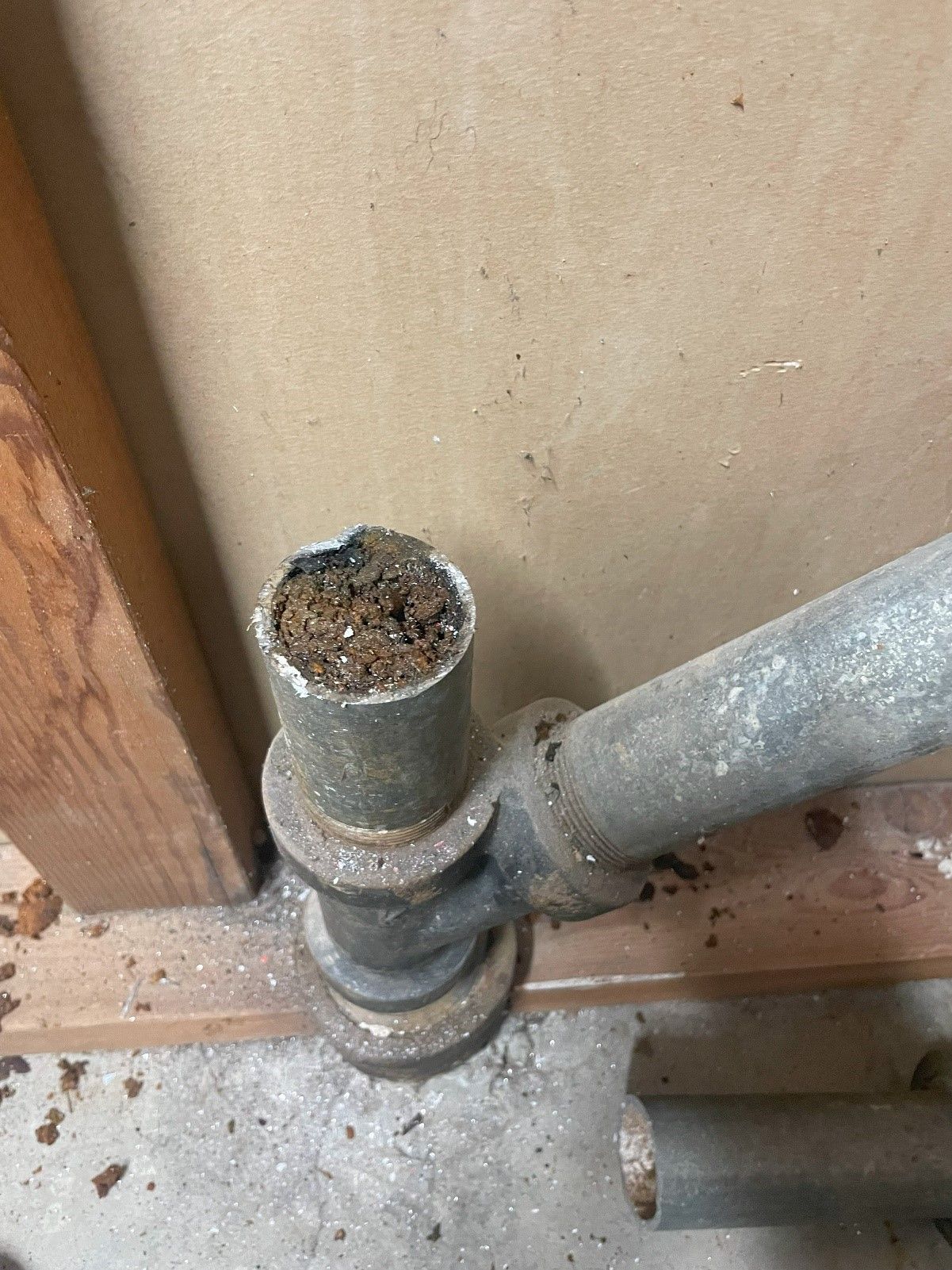 A close up of a pipe with a hole in it by royal flush plumbing in tacoma.