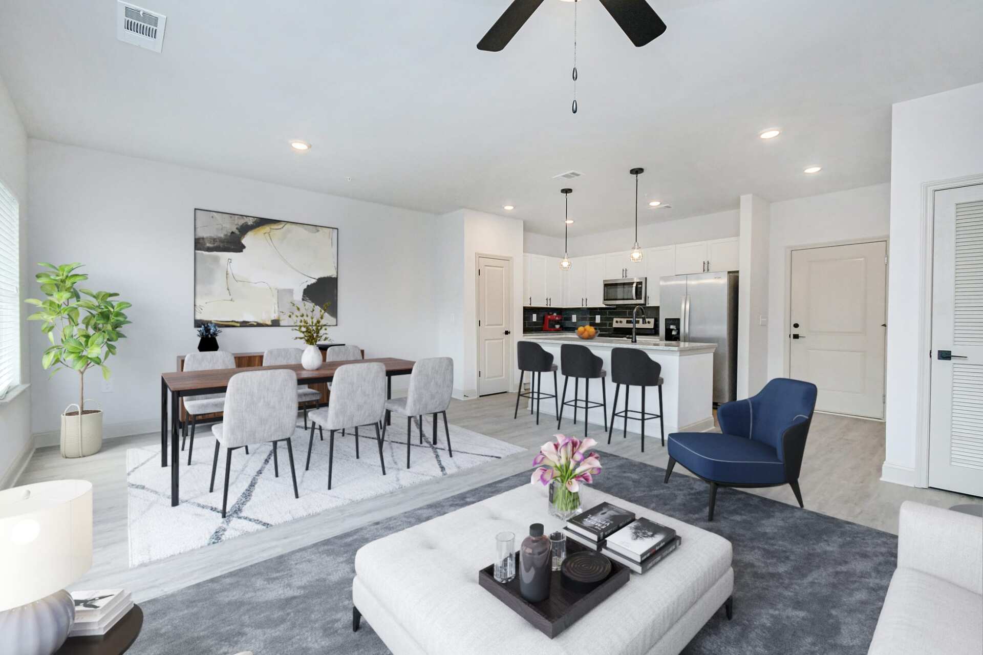 The Blakely open floor plan with living room, kitchen, and dining area.