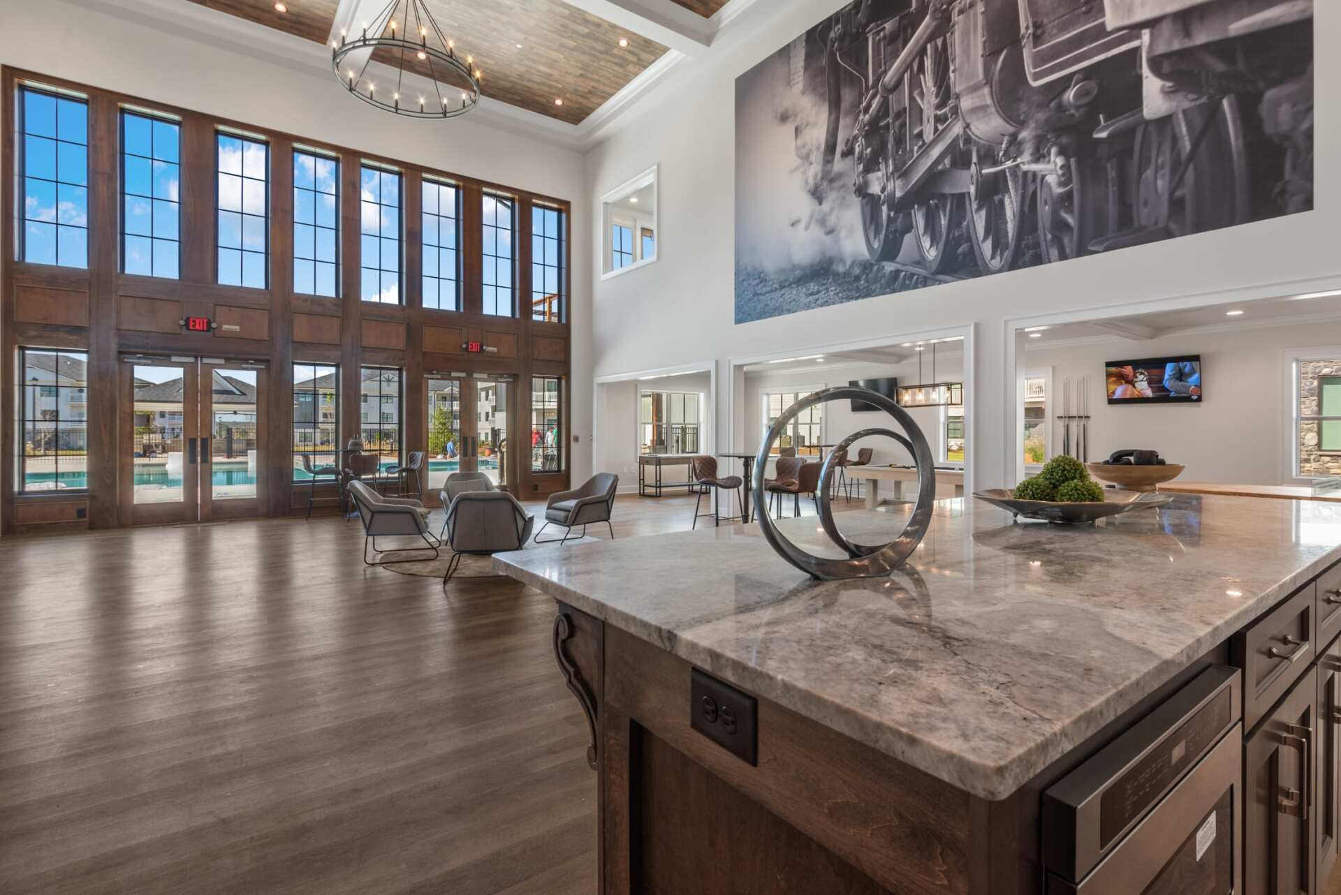 The Blakely apartment high ceiling clubhouse with pool view.