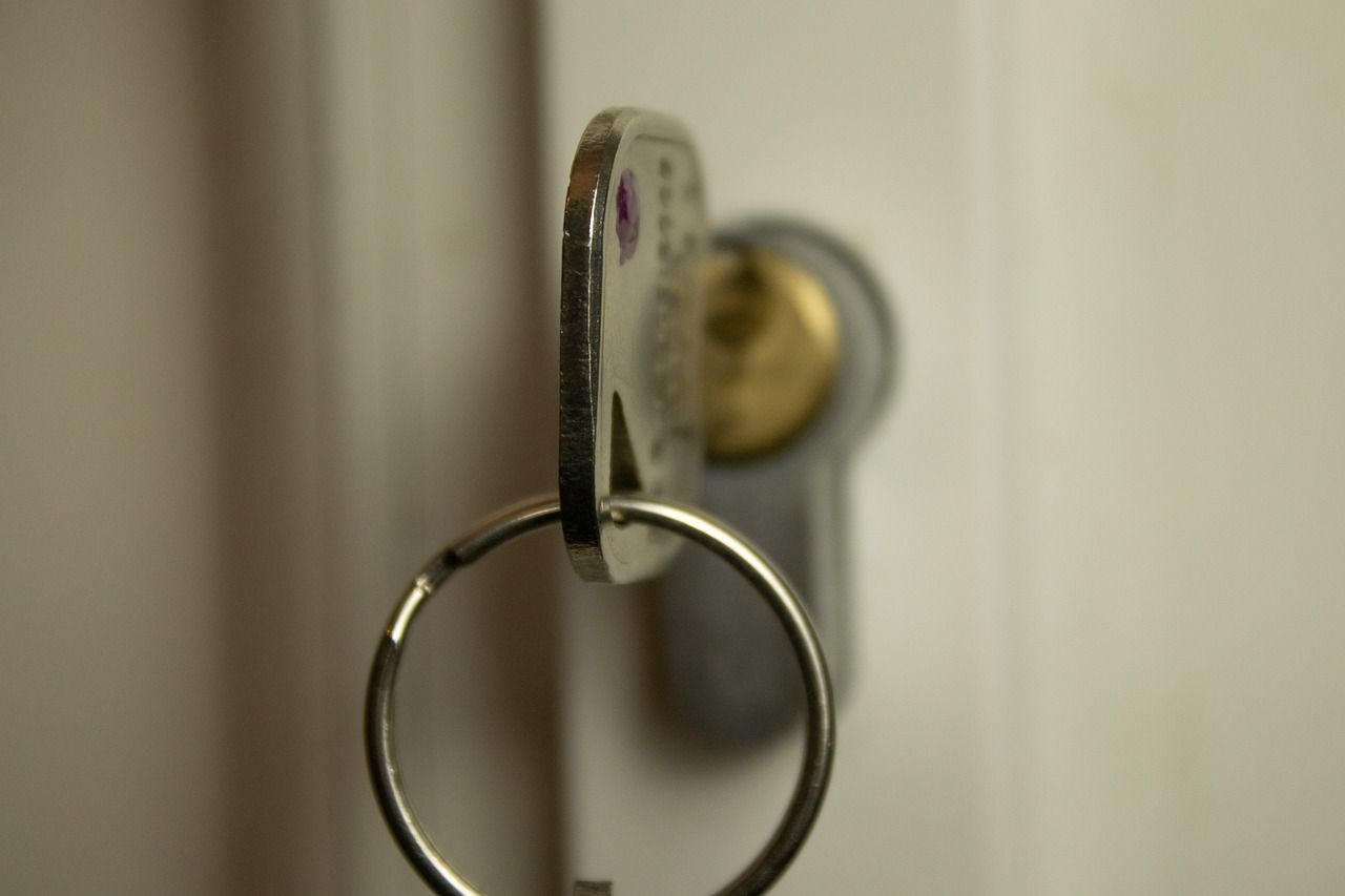 A close up of a key in a door lock