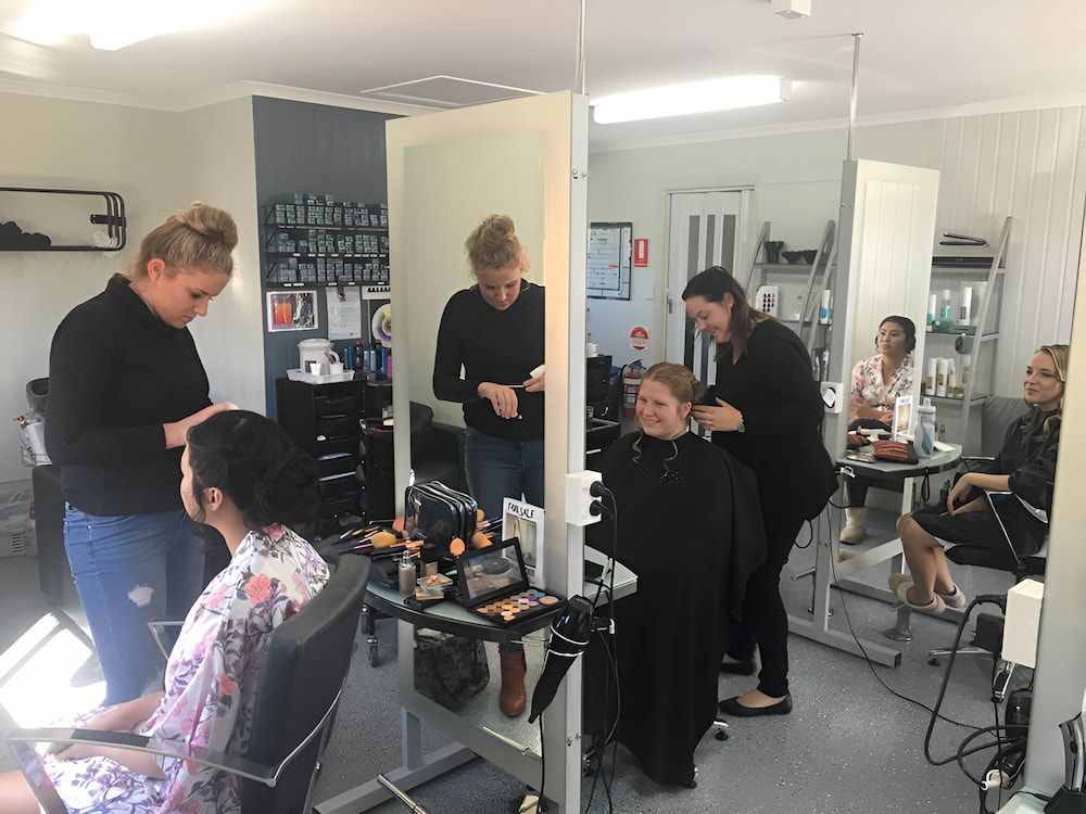 A Group of Women Are Getting Their Hair Done in a Salon — Rayzr Hair Artistry in Eli Waters, QLD