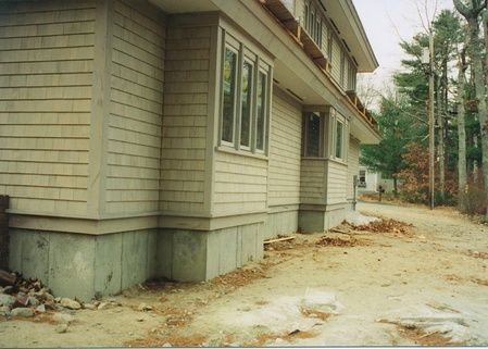 A house with a lot of windows is being built