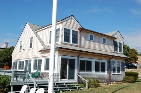A large house with a flag pole in front of it