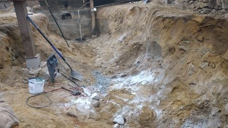 A large pile of dirt and rocks on a construction site.