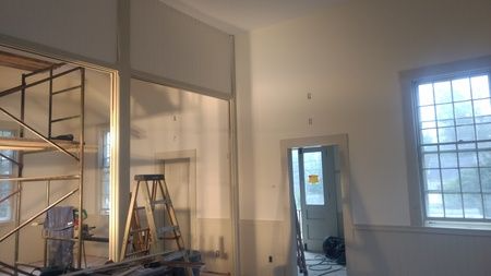 A room with a ladder and scaffolding in it.