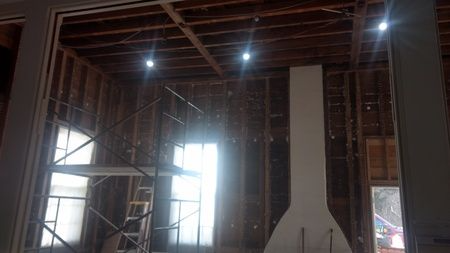 There is a fireplace in the middle of the room.