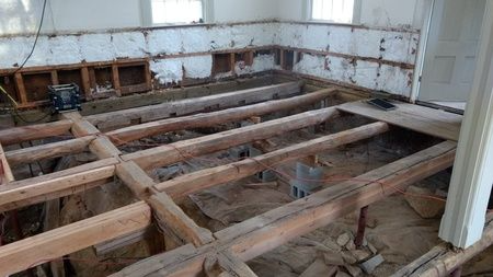 A wooden floor is being built in a room.
