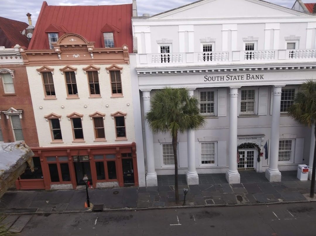 A white building with the word bank on it