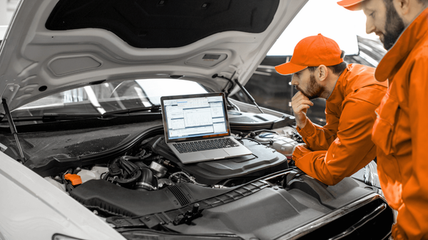 a mechanic taking a used car for a test drive