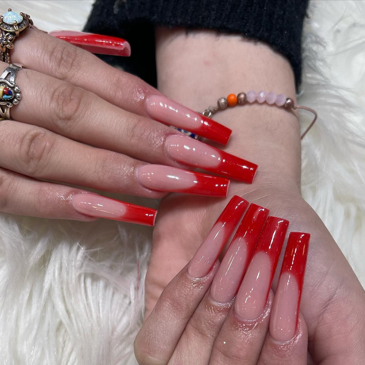A Person's Hands With Long Red Nails — San Diego, CA — Summer Nails and Spa