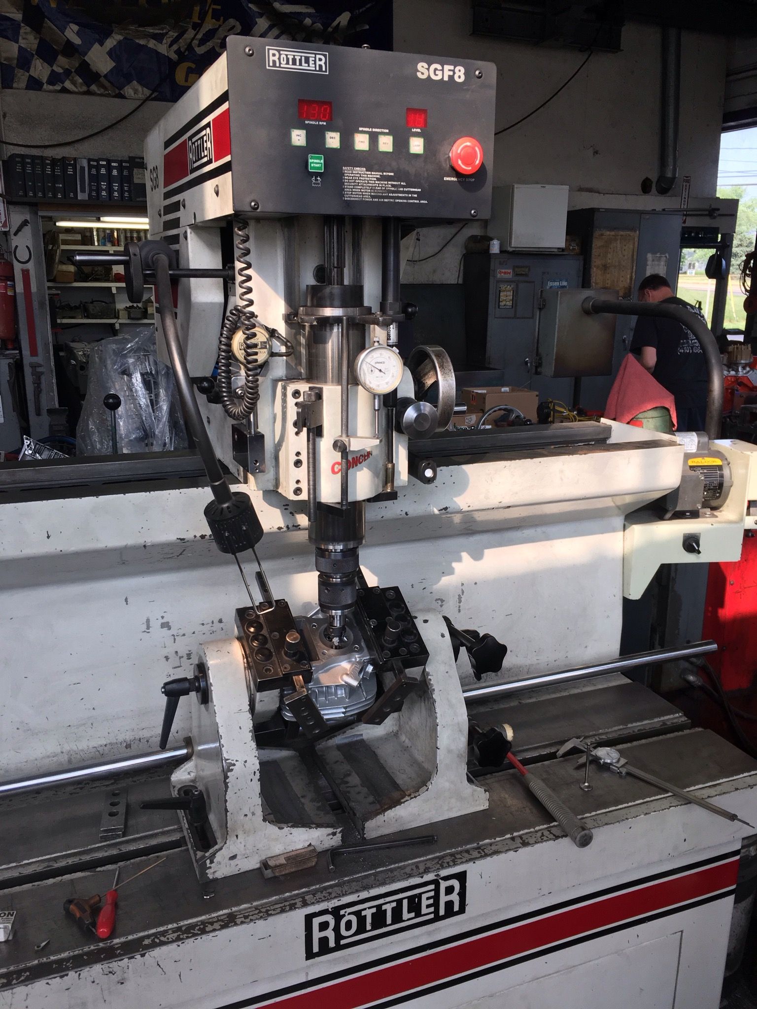 A Rottler engine cylinder head resurfacing machine in use.