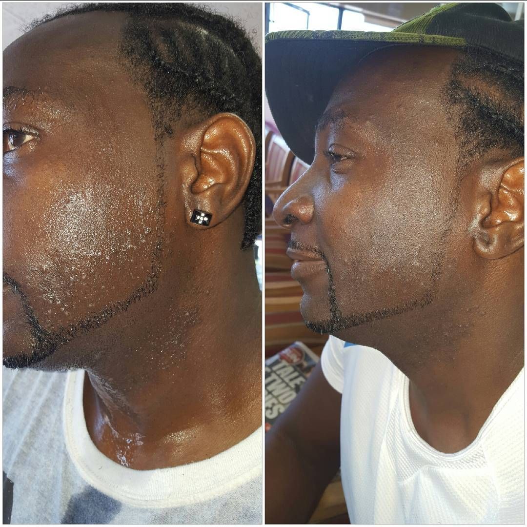 A man with a beard has a tattoo on his neck