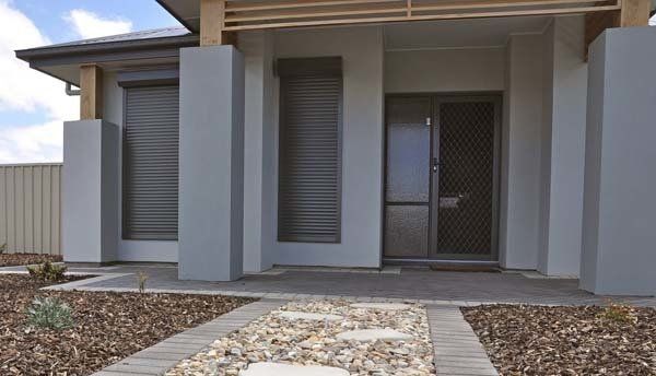 front of home with roller shutters