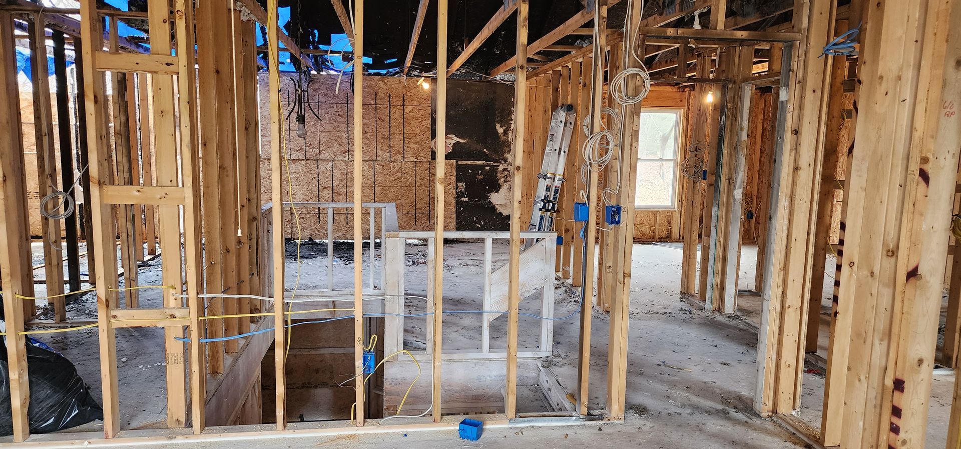 A house is being built with a lot of wooden beams.