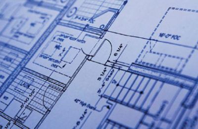 Architectural blueprint of a building's interior, with blue lines and text on white paper.