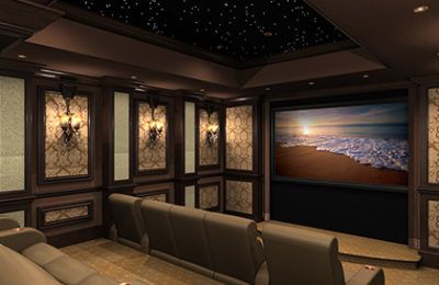 Luxury home theater with starry ceiling, dark wood paneling, and plush seating. A screen displays ocean waves.