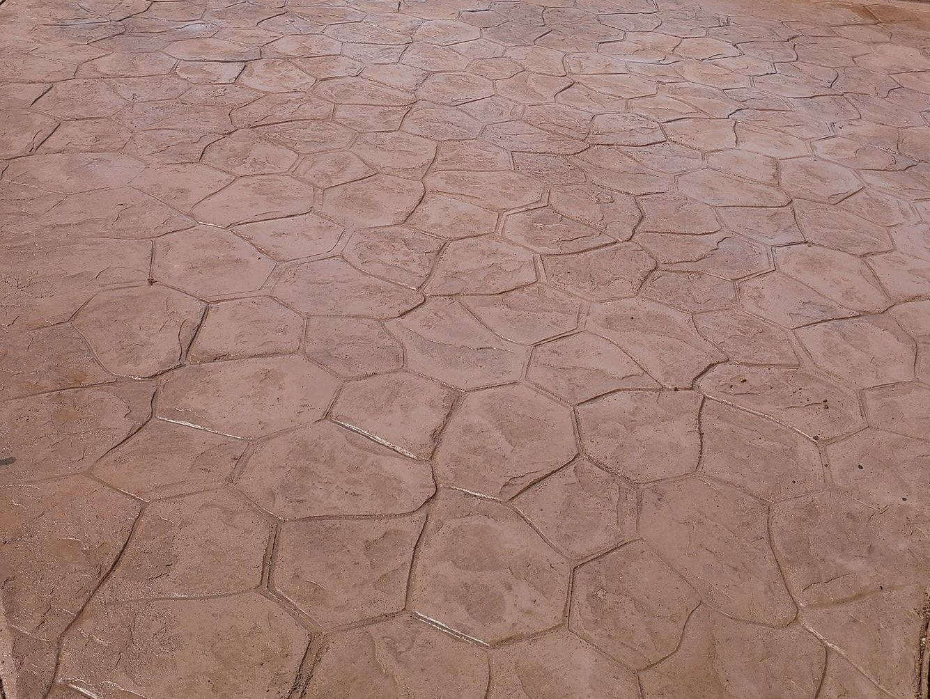 A close up of a concrete floor with a geometric pattern