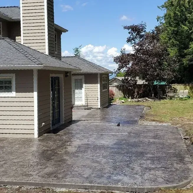 A smooth and durable newly installed concrete driveway in Bellingham, WA