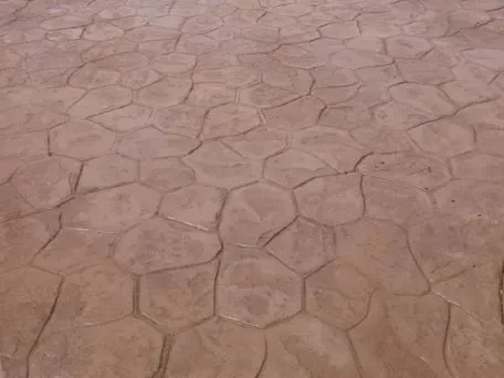 A close up of a brick floor with a hexagonal pattern