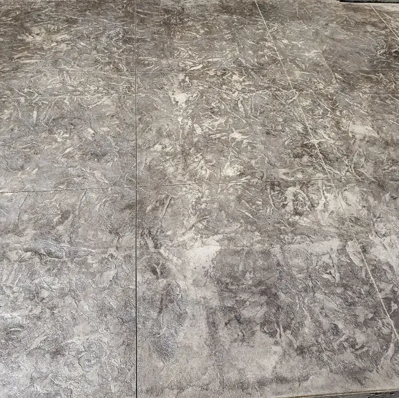 a close up of a gray stamped concrete floor with a marble texture in Bellingham Washington.