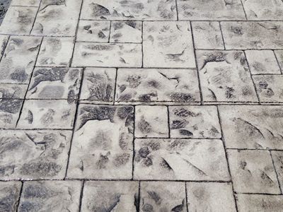 A black and white photo of a brick floor