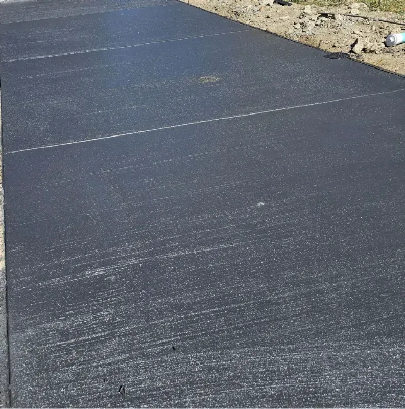 A concrete driveway with a few lines on it in Bellingham WA