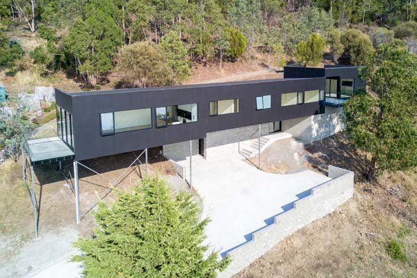 elongated modern house on a hillside