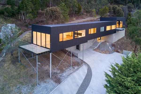 elongated modern home on a hillside