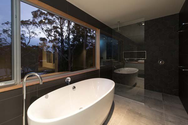 exposed bathtub with large window