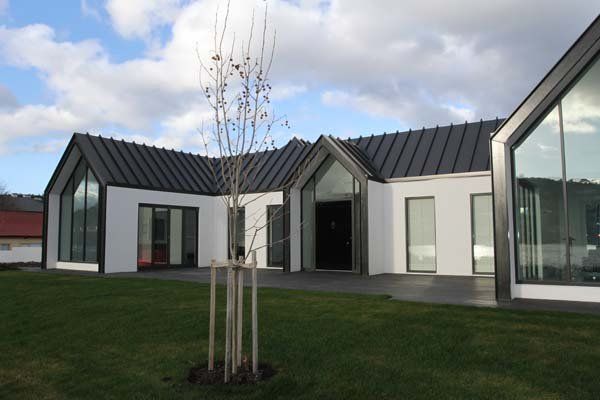 exterior view of modern house with black roof