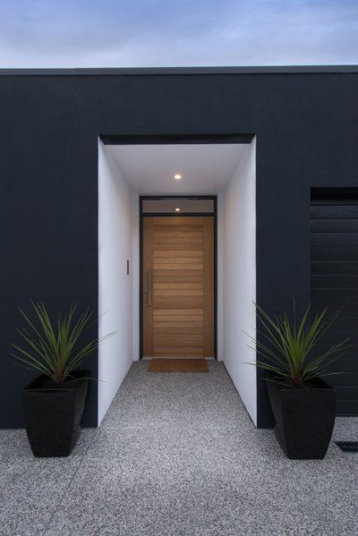 black home with white entryway