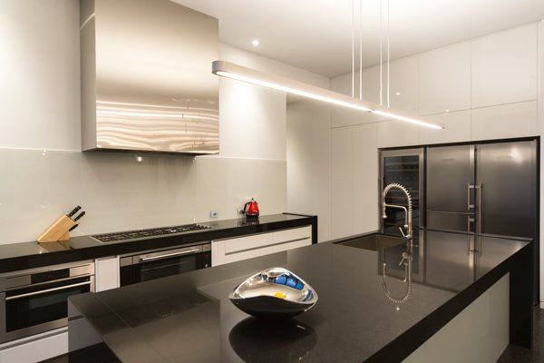 metal bowl on dark counter