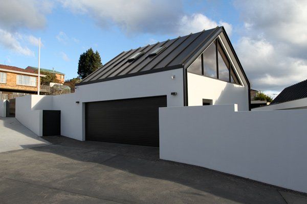 white house with black garage