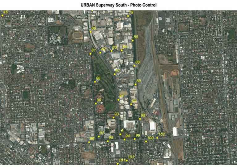 An aerial view of a city with the words urban superway south photo control