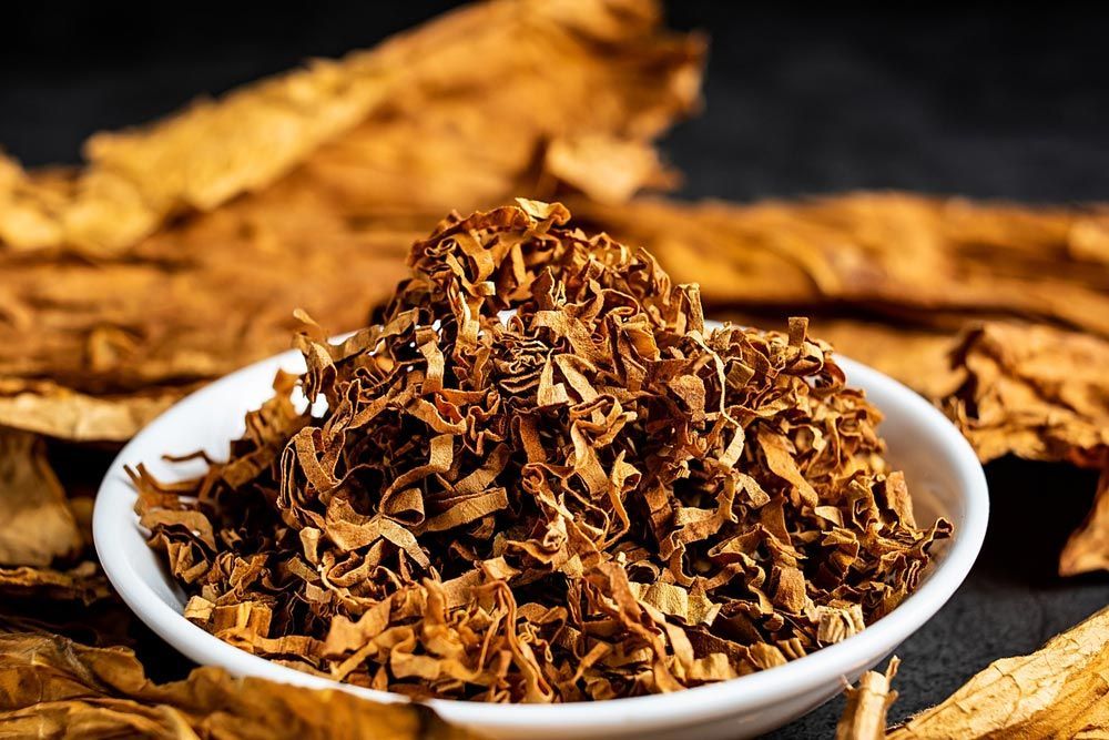 There Is A Bowl Of Tobacco Leaves In The Background — TGT Pty Ltd in Mareeba, QLD