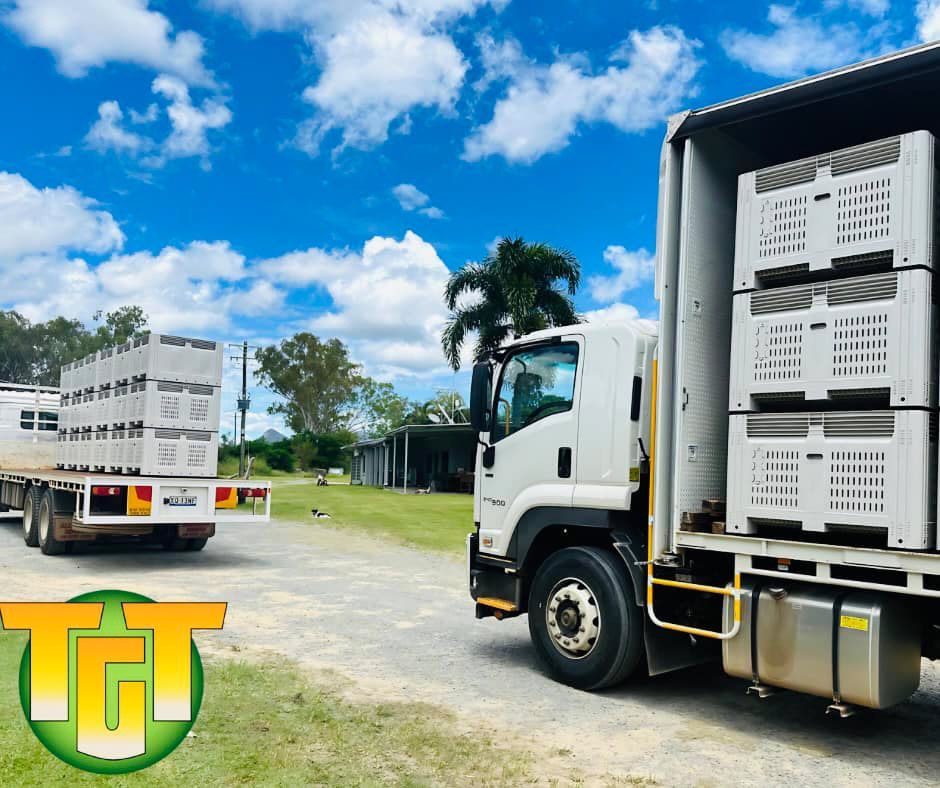 A Truck With Crates On The Back Is Parked Next To Another Truck — TGT Pty Ltd in Mareeba, QLD