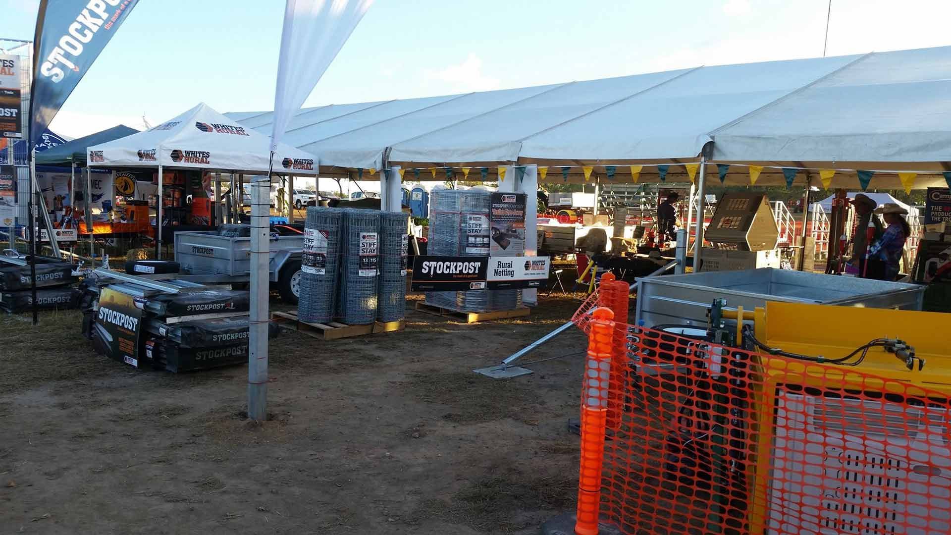 A Large White Tent Is Sitting In The Middle Of A Dirt Field — TGT Pty Ltd in Mareeba, QLD