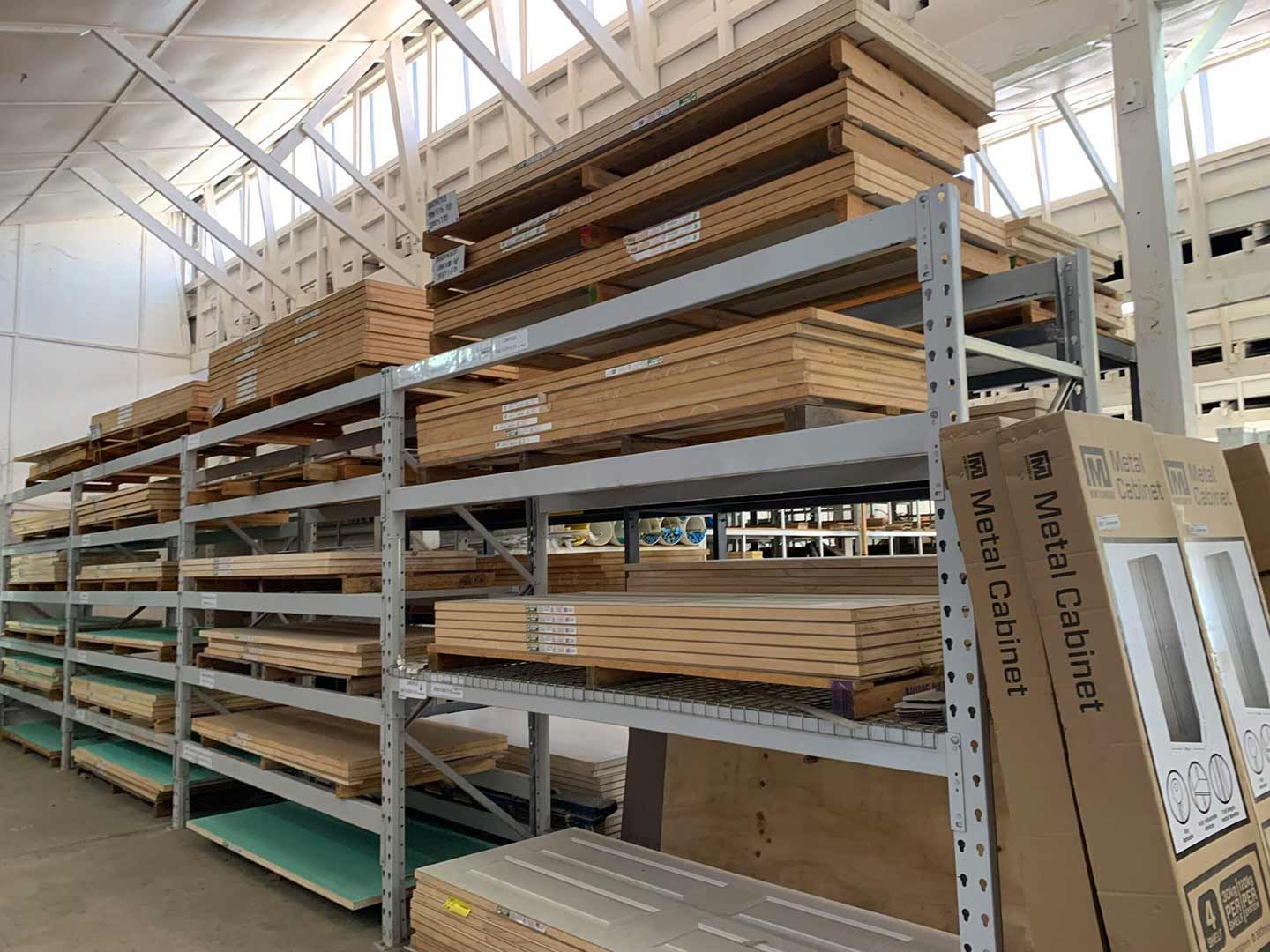 A Warehouse Filled With Lots Of Wooden Shelves And Boxes — TGT Pty Ltd in Mareeba, QLD