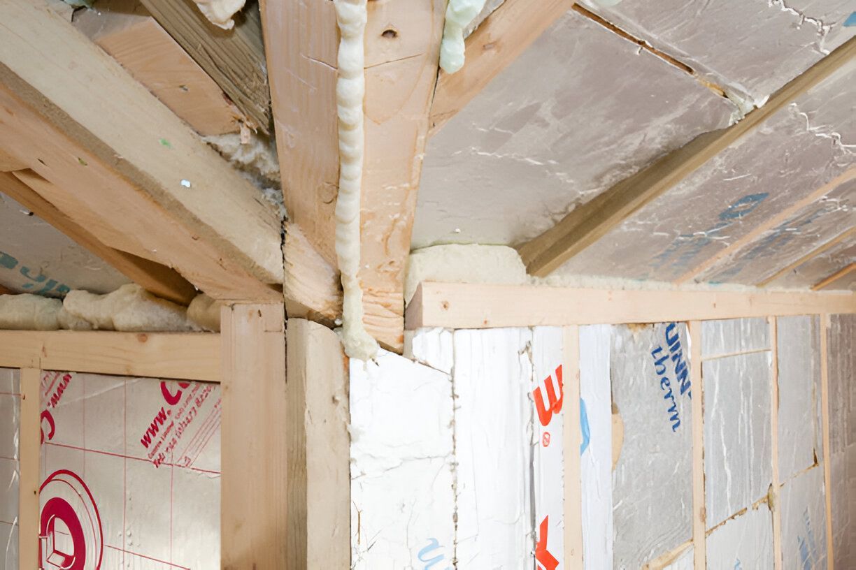 A wooden structure with insulation on the walls and ceiling.