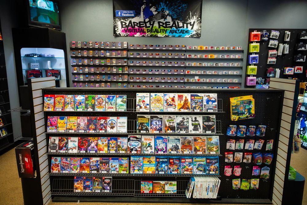 A brightly lit video game store with shelves filled with game cartridges and boxes. 