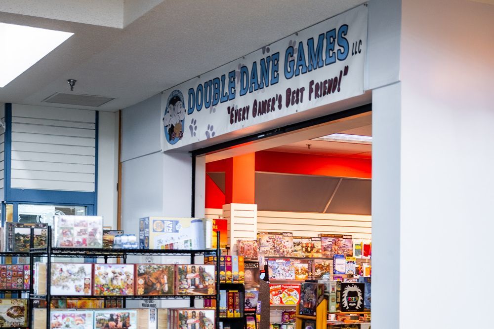 Double Dame Games store sign above an entrance. 