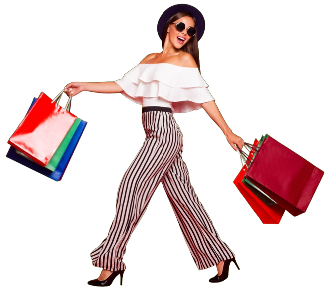 Woman in stylish outfit holding shopping bags, walking and smiling.