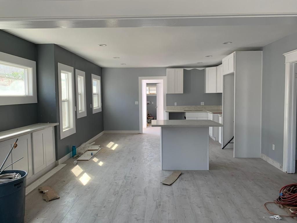 A kitchen with a large island in the middle of the room.