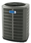 An outdoor air conditioning unit with a fan on top and metal grates.