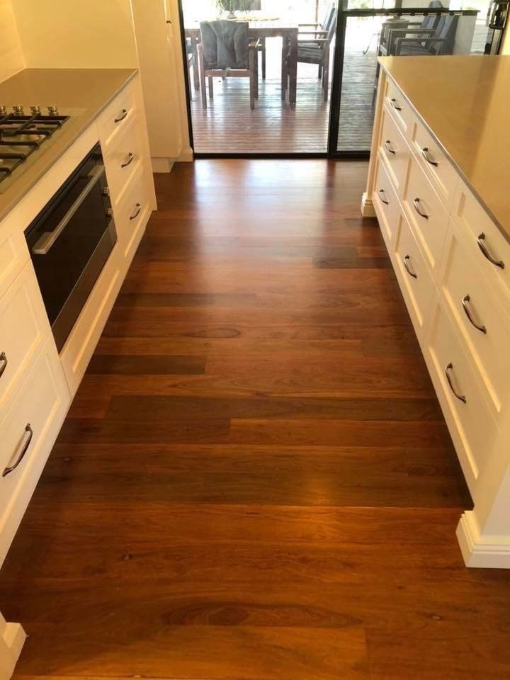 hall way with reddish wood floor