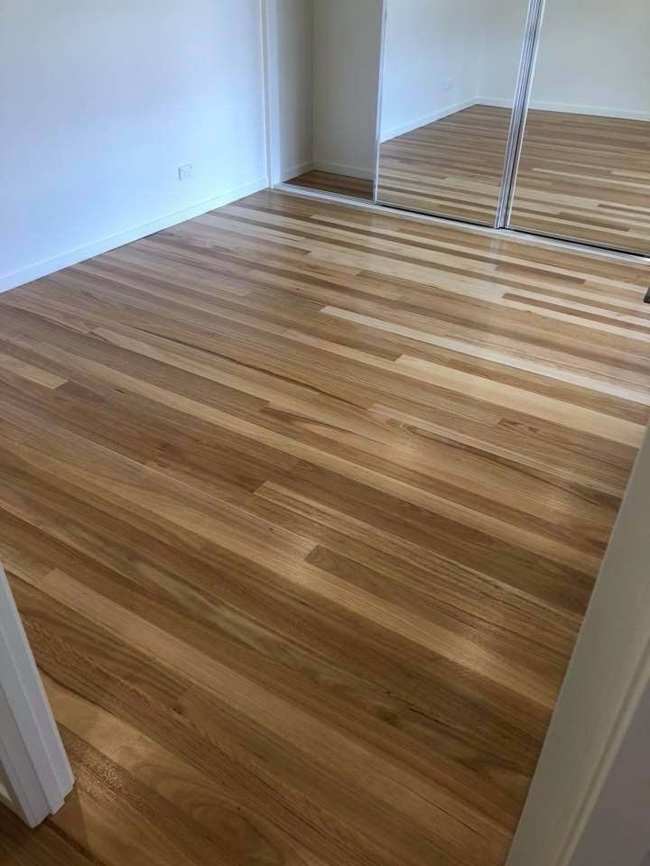 medium dark wood floors in bedroom