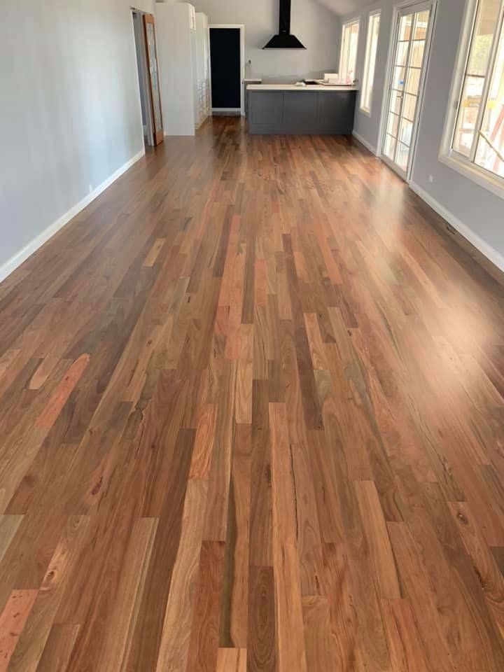 medium dark wood floors in empty room