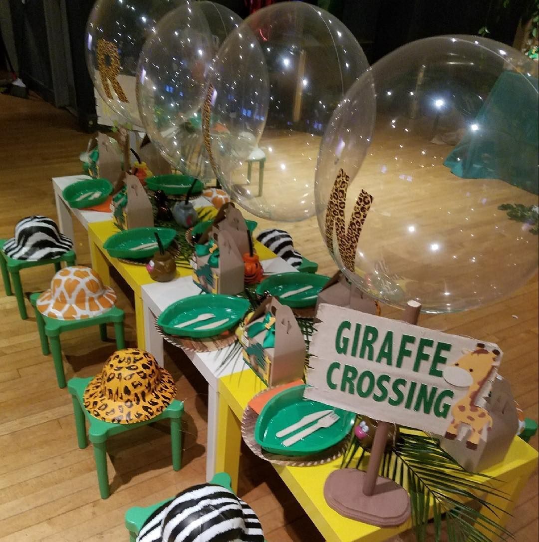 A table set up for a giraffe crossing party