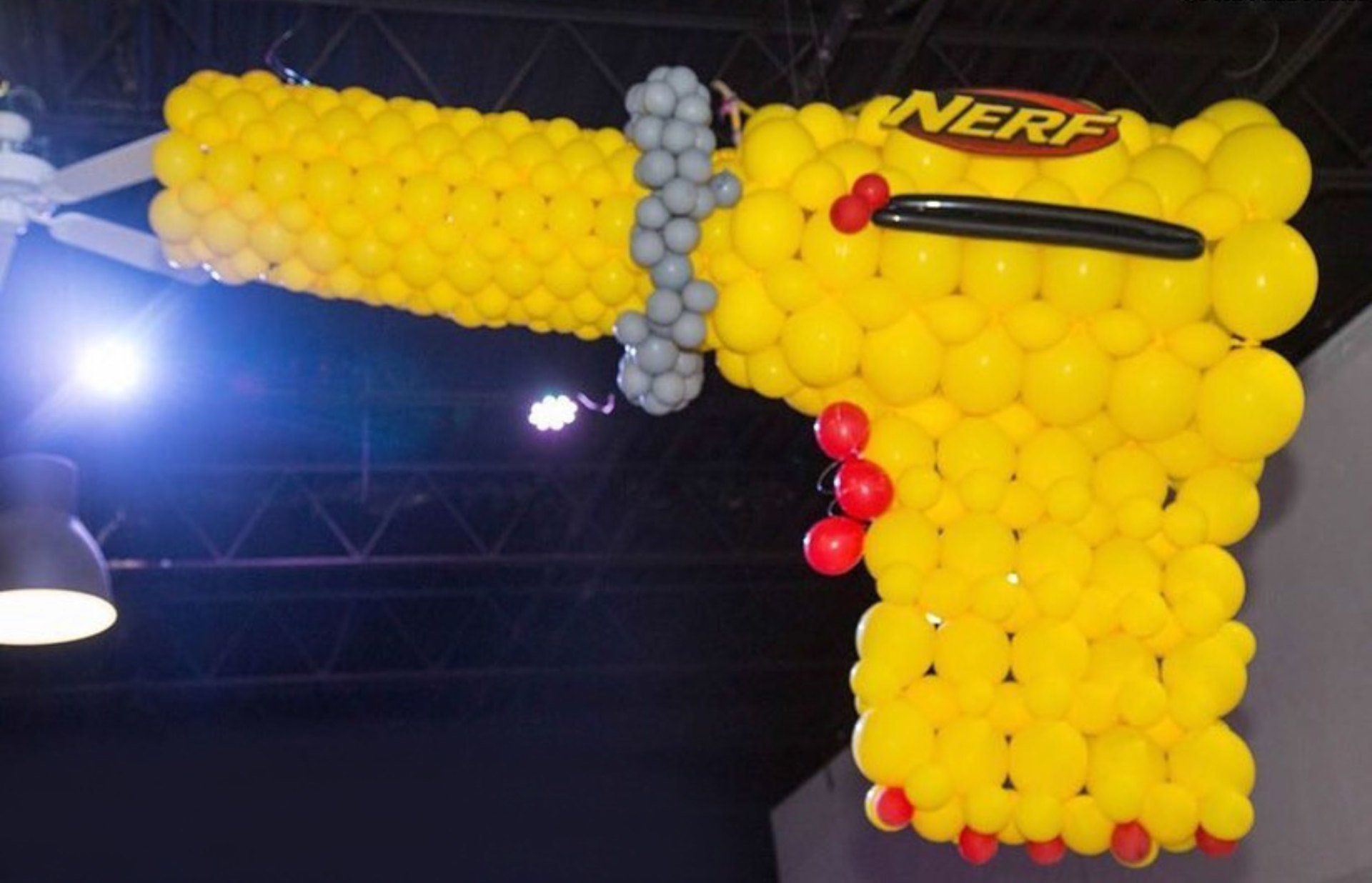 large nerf gun made of yellow balloons